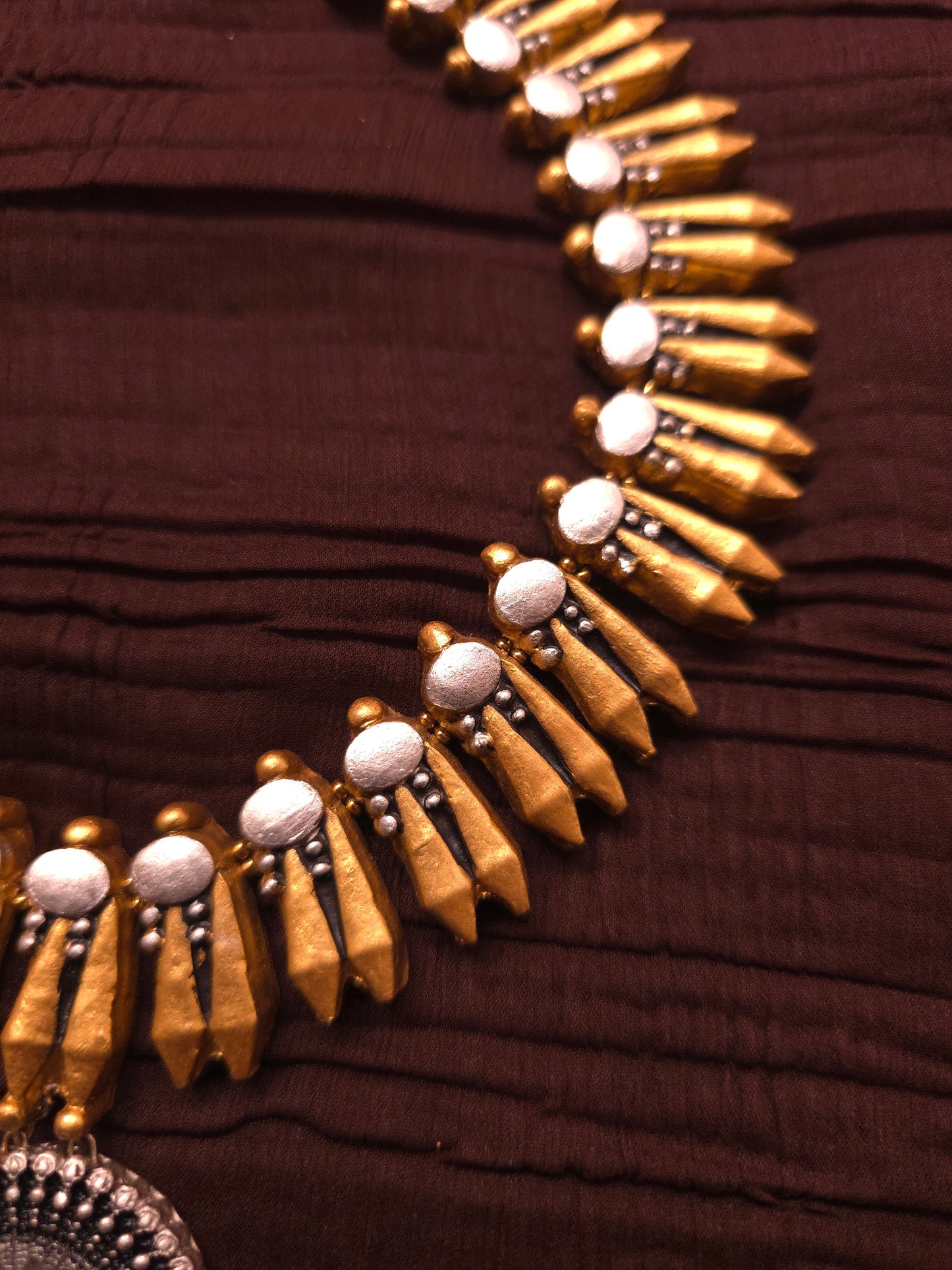 The dual-tone chakra aura dual-finish spike motif terracotta set