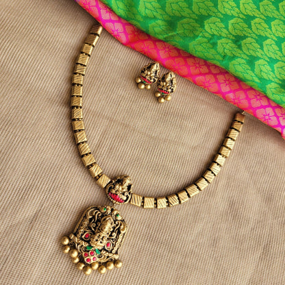 Handcrafted terracotta pendant with pink and green bead detailing1