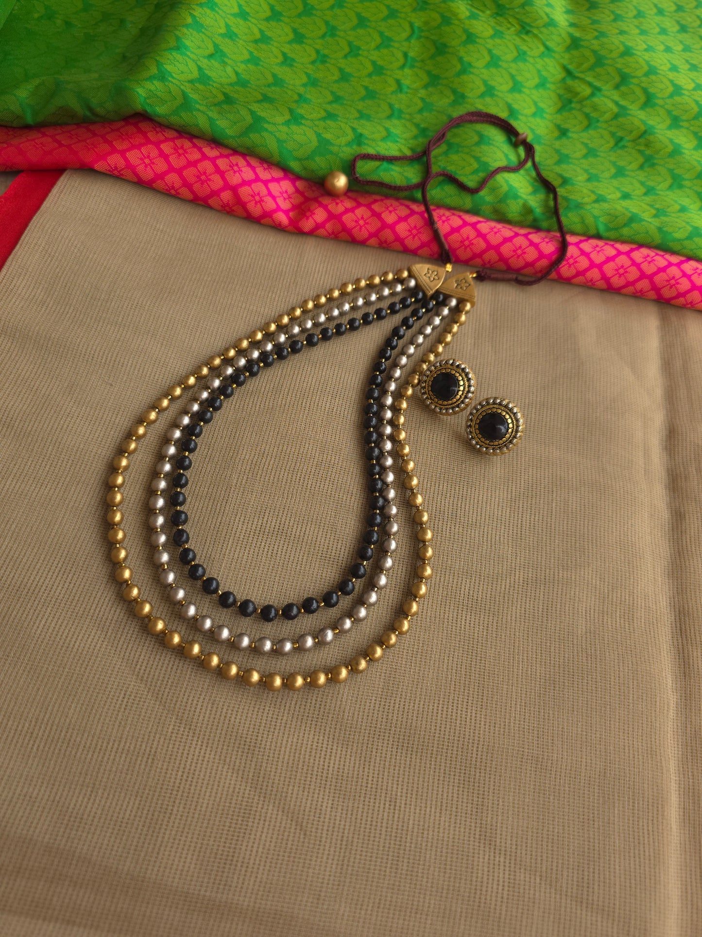 Hand painted terracotta necklace with layered beads