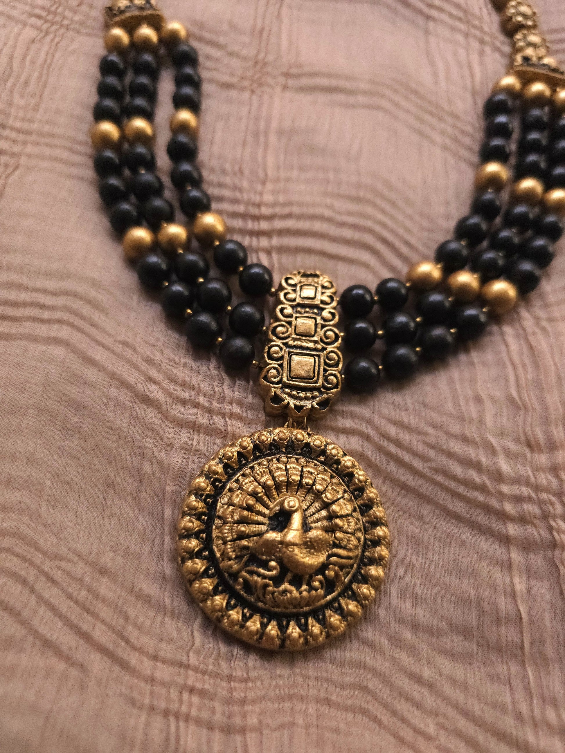 Mayura Antique Gold Peacock Medallion & Three-Layer Jet Black Terracotta Set