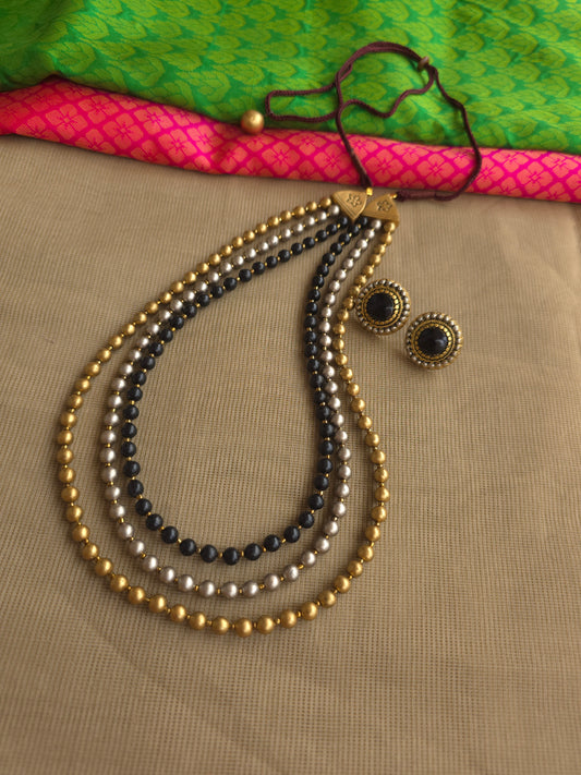 Triple layer terracotta bead necklace gold black silver design