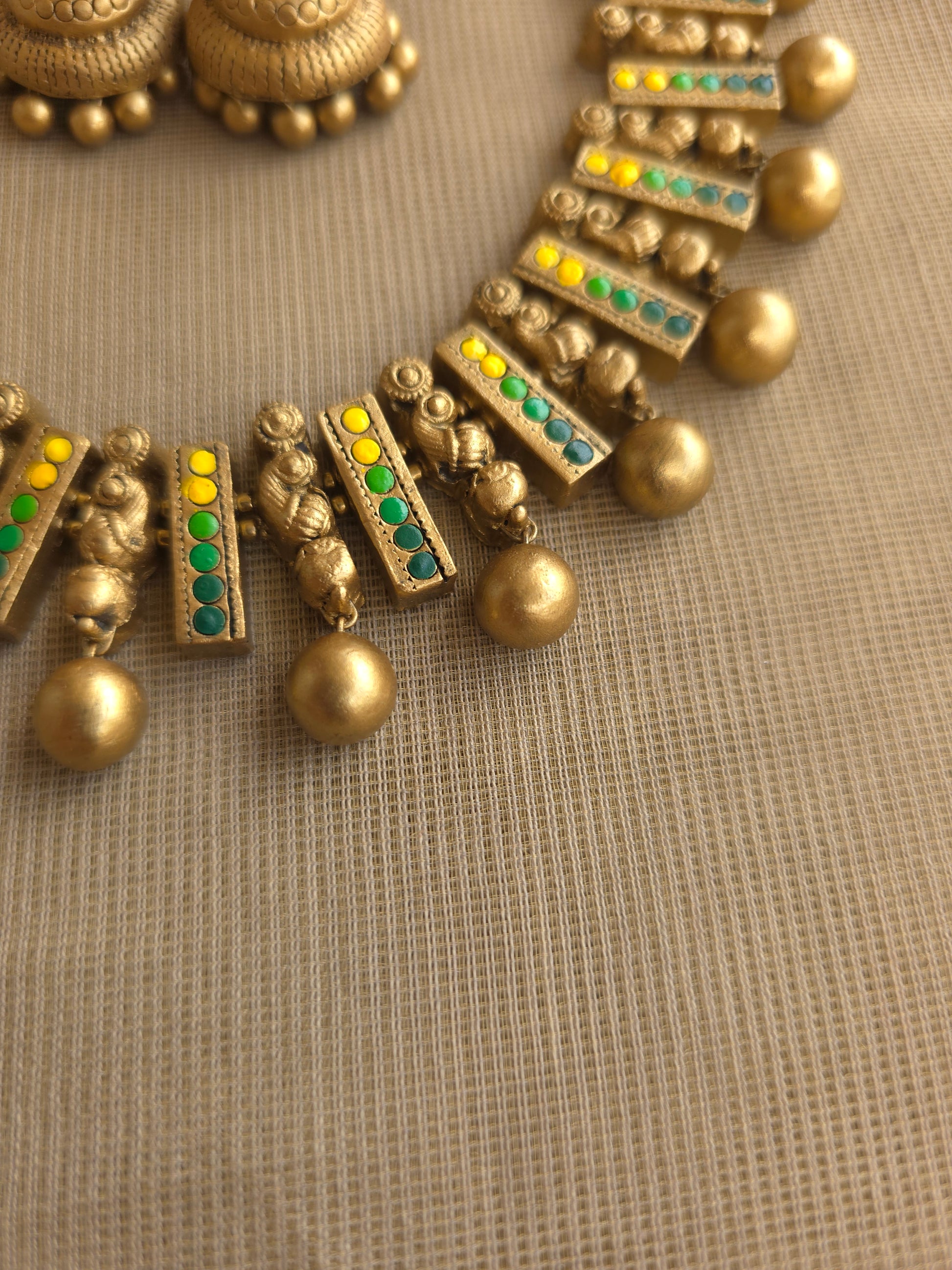 Yellow green terracotta necklace peacock motif design